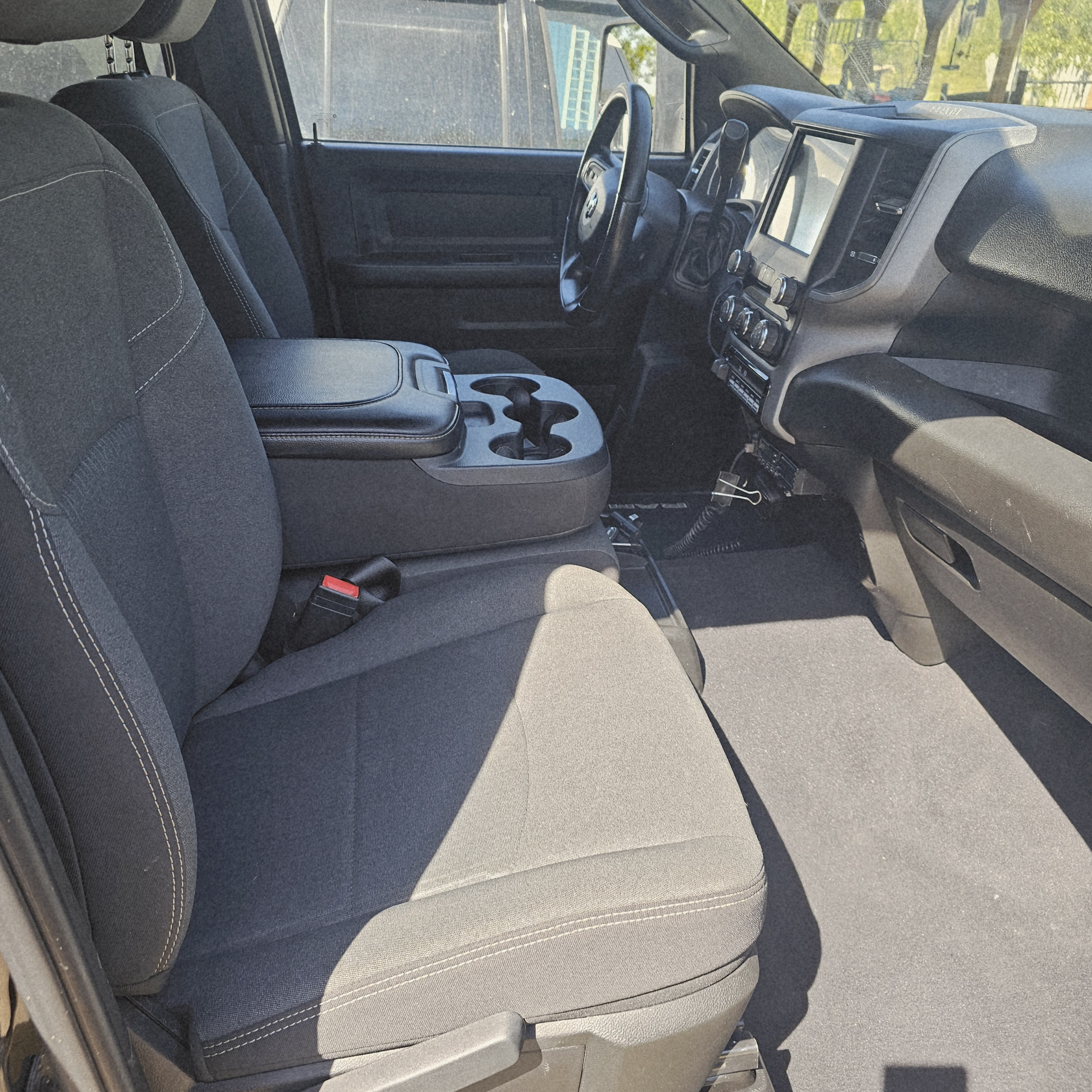 Clean Ram 2500 front cabin featuring detailed seats, center console, dashboard, and flooring after professional interior detailing.
